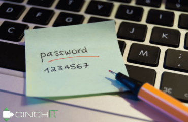 Network Security - sticky note on laptop keyboard demonstrates insecure password.